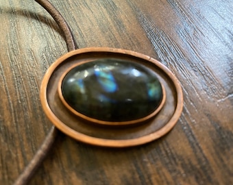 labradorite cab in primitive copper setting on leather cord.  unisex.