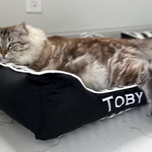 Toby the cat enjoying his comfy 22x22 cuddle bed