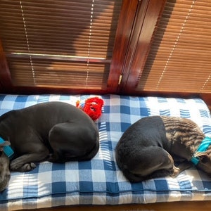 two dogs enjoying their custom size buffalo plaid dog bed