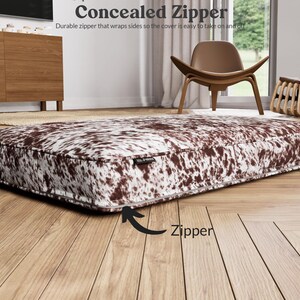 concealed zipper that goes along the back and wraps both sides slightly to make taking the cover off and on easy