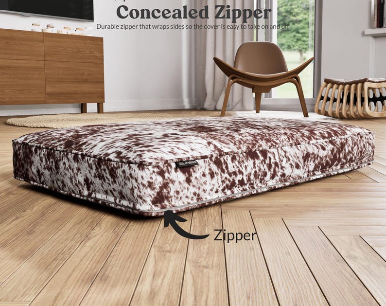 concealed zipper that goes along the back and wraps both sides slightly to make taking the cover off and on easy