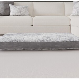 speckled gray with distressed banding. 52x36 with Fiberfill