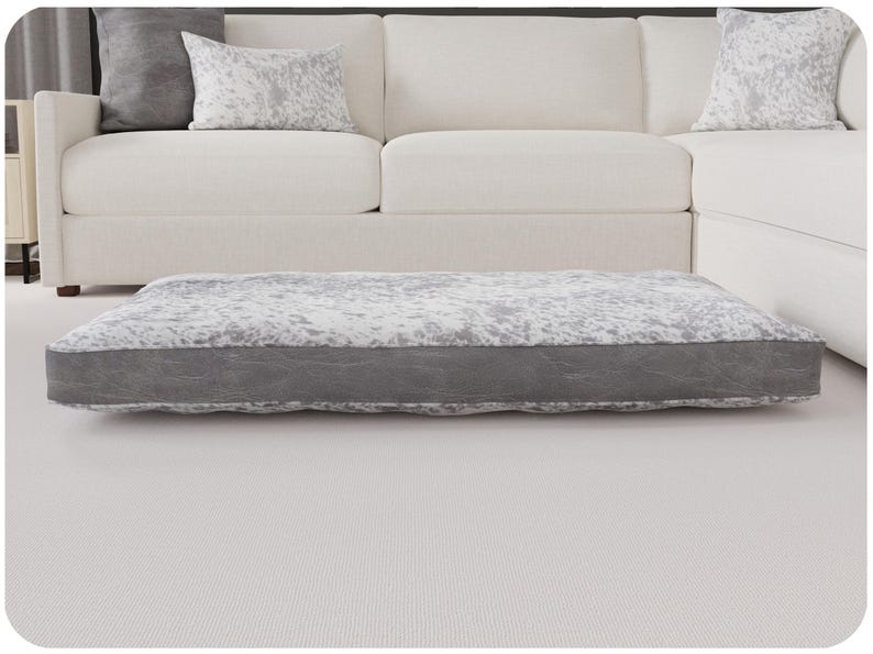 speckled gray with distressed banding. 52x36 with Fiberfill