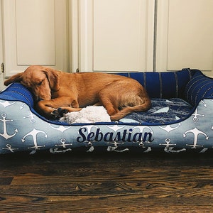 x-large cuddle dog bed with a happy golden retriever