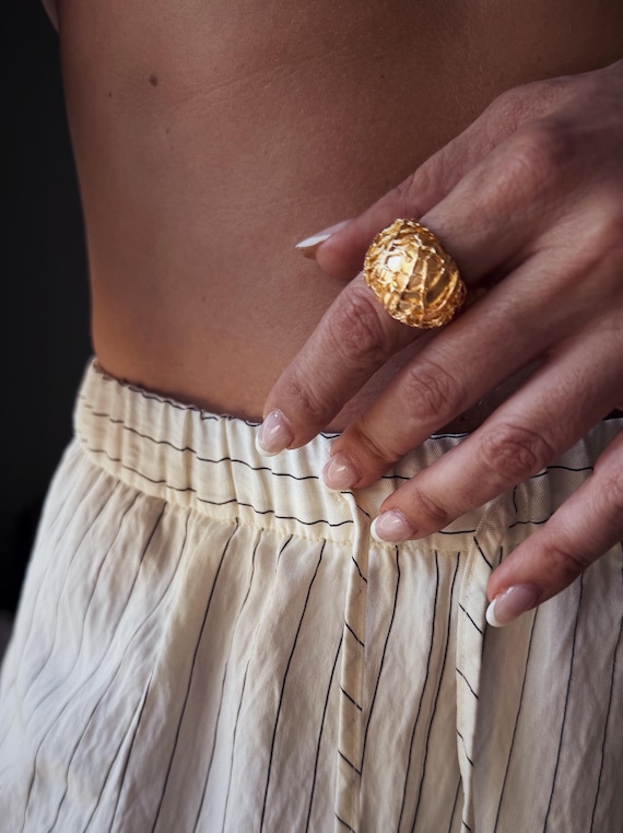 Gold bold ring with organic texture