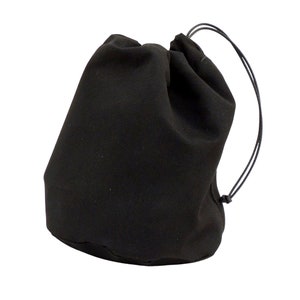 May include: A black drawstring bag made of fabric with a cinched top and a long cord.