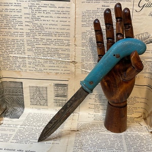 Vintage homemade knife with saw handle