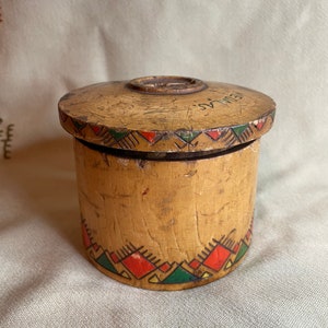 Vintage wooden piggy bank. Savings bank in the style of national romanticism.