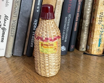 Vintage Polish "PRASTARA" FLORINA cologne bottle in braided cover.