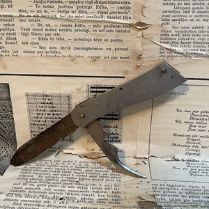 An old, disassembled folding knife.