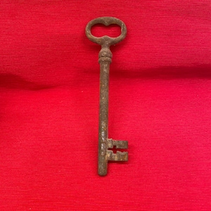 Large retro door key. Big rusty key.