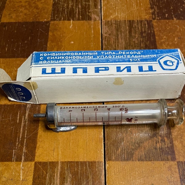 Vintage, old Soviet glass medical injection syringe with factory defect