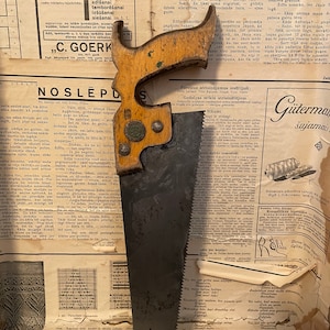Vintage handsaw with quality mark. Saw with German quality mark.