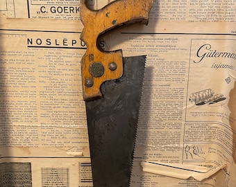 Vintage handsaw with quality mark. Saw with German quality mark.