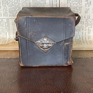 Vintage leather camera bag with owner&#39;s name and address