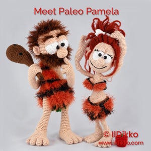May include: Two crocheted dolls, one with brown hair and a club, the other with red hair and a bone accessory, both wearing orange and black fur-like outfits. The text "Meet Paleo Pamela" appears at the top, and "ildikko.com" is at the bottom.