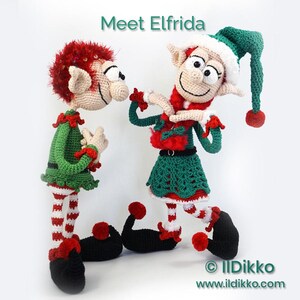 May include: Two crocheted elf dolls with the text Meet Elfrida. The dolls have beige skin, red hair, green and red outfits, striped legs, and black curled shoes with red pom-poms. The text IlDikko www.ildikko.com is visible at the bottom.