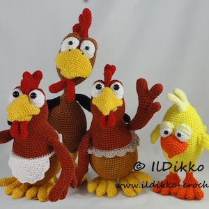 May include: Four crocheted chickens, two brown, one yellow, and one red, with white aprons. The chickens have large eyes and beaks. The yellow chicken is standing on the right, the red chicken is on the left, and the two brown chickens are in the middle.