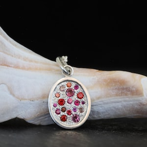 Multi gemstones, sapphires, rubies, tourmalines, spinels sterling silver pendant.