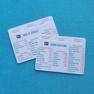 May include: Two white cards with blue and red text listing dining and bar options on a cruise ship. The cards are labelled "Pride of America" and "Norwegian Pearl".