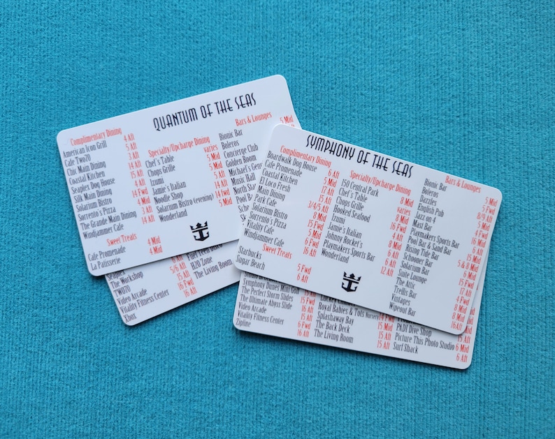 May include: Two white cards with red text listing dining options on a Royal Caribbean cruise ship. The cards are for Quantum of the Seas and Symphony of the Seas. The cards list complimentary dining, specialty dining, and bars and lounges.