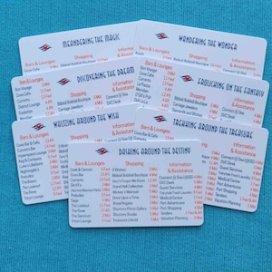 May include: A collection of seven white rectangular cards featuring blue text and red headers. Each card lists ship locations including Bars & Lounges, Shopping, and Information & Assistance, with titles like Meandering the Magic and Dashing Around the Destiny.