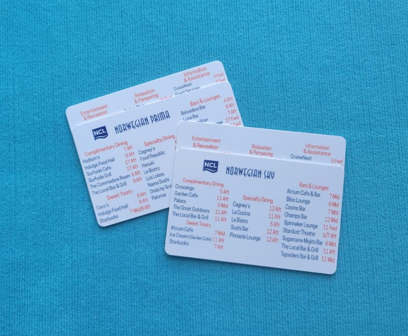 May include: Two white cards with black text listing dining options and times on a cruise ship. The cards are for the Norwegian Prima and Norwegian Sky cruise ships.