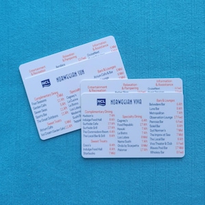 May include: Two white cards with black text listing dining and bar options on a cruise ship. The cards are for the Norwegian Sun and Norwegian Viva cruise ships. The cards list complimentary dining, speciality dining, bars and lounges, and sweet treats.
