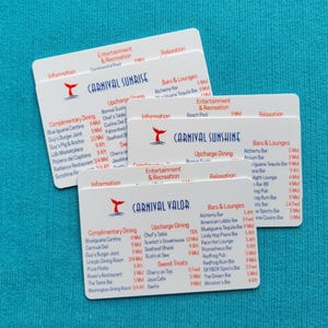 May include: Three white rectangular plastic cards featuring the Carnival cruise ship logos and names Carnival Sunrise, Carnival Sunshine, and Carnival Valor, with printed lists of dining, entertainment, and bar locations on each card.