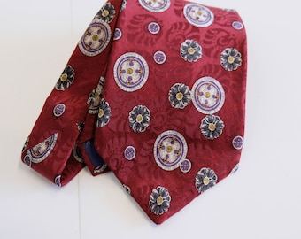 1990's Vintage Liberty Of London Silk Necktie / Tie Emblem or Insignia Print in Maroon Grey White Black Purple & Mustard 4" wide by 54" long