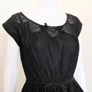 1950&#39;s vintage black cotton fit and flare capped sleeved full pleated skirt dress with side zipper crochet cut out open neckline 26&quot; waist