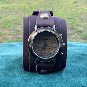Dark Brown Leather Cuff Watch with Bronze Music Note Face