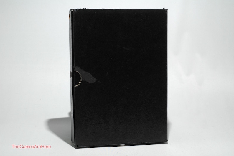 May include: A black cardboard box with a plain surface.