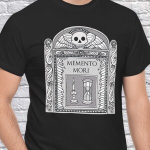 Illustration of a grave stone from the 1800s with a skull, candle, and hourglass on it. States Memento Mori. Design on a t-shirt.