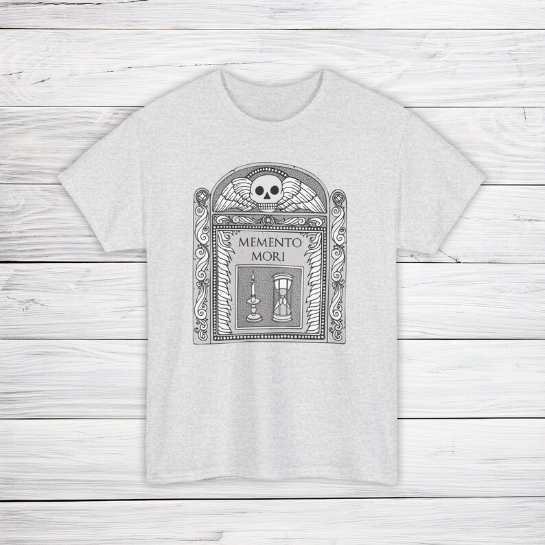 Illustration of a grave stone from the 1800s with a skull, candle, and hourglass on it. States Memento Mori. Design on a t-shirt.