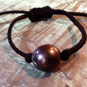 Tahitian black pearl bracelet on leather.
