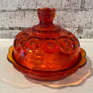 May include: A rustic wooden sign with the text "Welcome" in white lettering. The sign features a distressed finish and a simple, inviting design, perfect for a front porch or entryway.