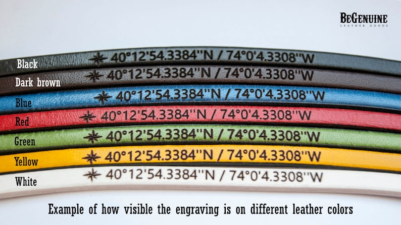 May include: A close-up of seven leather straps in different colors, each with the same engraved text: "40&deg;12'54.3384"N / 74&deg;0'4.3308"W". The colors are black, dark brown, blue, red, green, yellow, and white. The text is visible on each strap, but the visibility varies depending on the color of the leather.