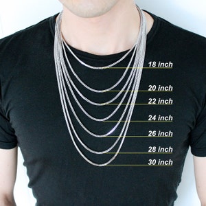 May include: A silver chain necklace in various lengths from 18 to 30 inches. The necklace is shown on a person's neck to demonstrate the different lengths.