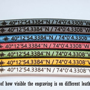 May include: A close-up of seven leather straps in different colors, each with the same engraved coordinates: 40&deg;12'54.3384"N / 74&deg;0'4.3308"W. The text "BEGENUINE LEATHER GOODS" is visible in the upper right corner. The caption below the straps reads "Example of how visible the engraving is on different leather colors."