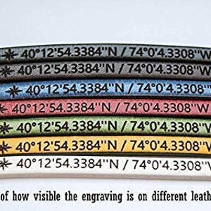 May include: A close-up of seven leather strips in different colors, each with the same text engraved on them: "40&deg;12'54.3384"N / 74&deg;0'4.3308"W". The colors are black, dark brown, blue, red, green, yellow, and white. The text is visible on each color, but the visibility varies depending on the color of the leather.
