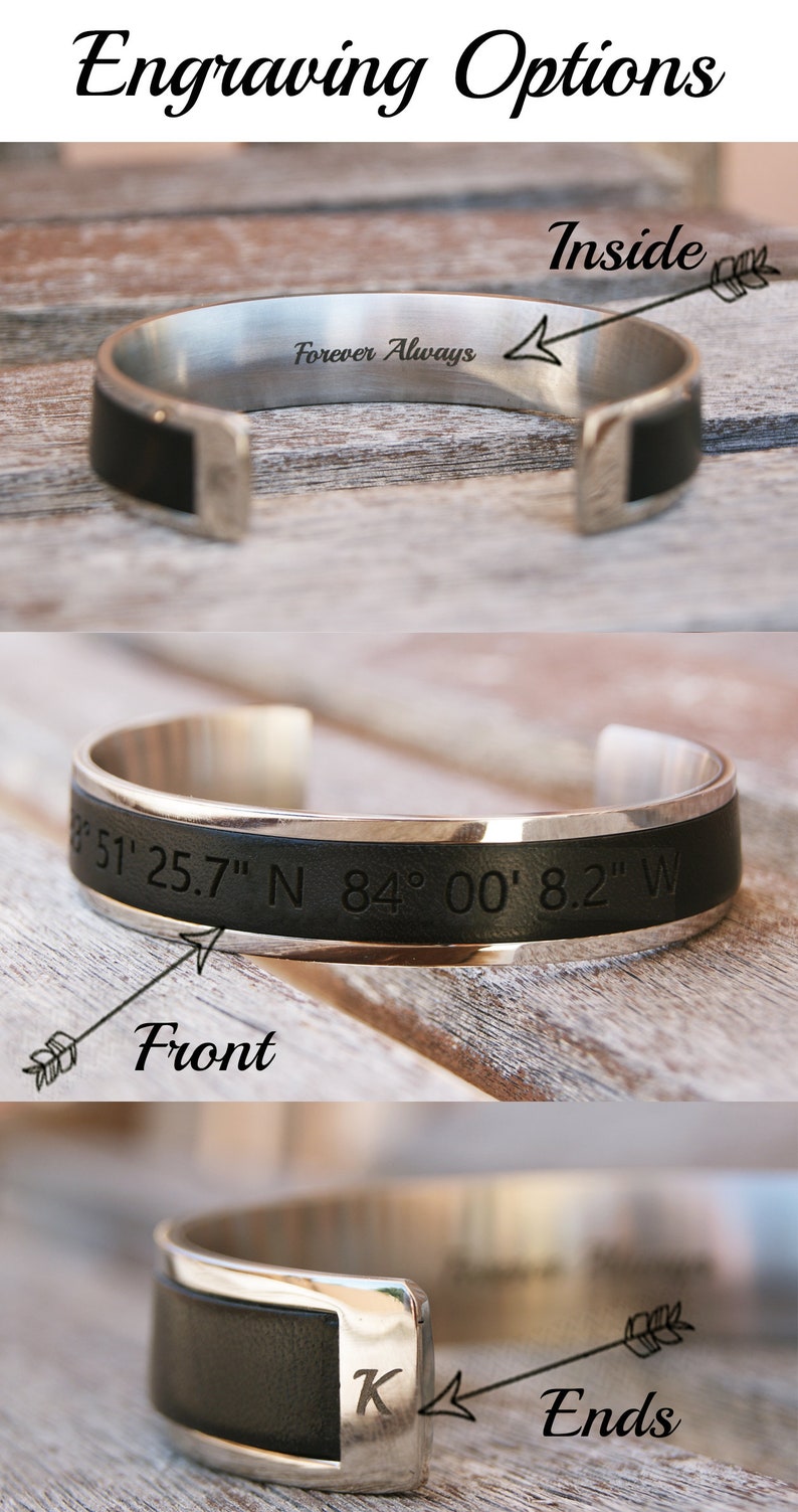 May include: A silver bracelet with a black leather band. The bracelet can be engraved with text on the inside, front, or ends. The image shows examples of engraving: "Forever Always", "51' 25.7" N 84&deg; 00' 8.2" W", and "K".