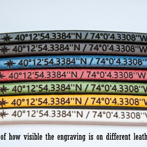May include: A close-up of seven leather straps in different colours, each with the same engraved coordinates: 40&deg;12'54.3384"N / 74&deg;0'4.3308"W. The colours are black, dark brown, blue, red, green, yellow, and white. The text "BEGENUINE LEATHER GOODS" is visible in the top right corner. The text "Example of how visible the engraving is on different leather colours" is visible at the bottom of the image.