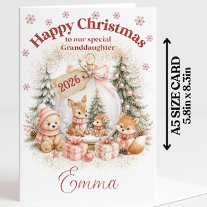 May include: A white Christmas greeting card featuring a bear, deer, and fox illustration with a glass ornament, gifts, and the text Happy Christmas to our special Granddaughter 2026 Emma. The card measures 5.8 inches by 8.3 inches.