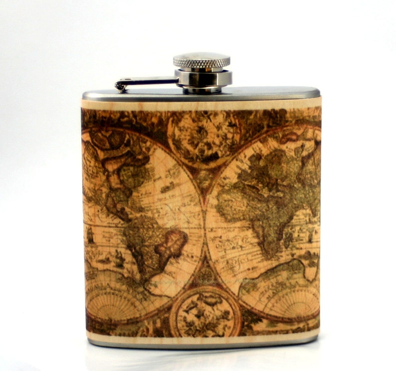 May include: A stainless steel flask with a vintage world map design. The flask has a silver cap and a hinged lid.
