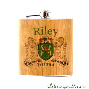 Your family crest on a wood wrapped flask