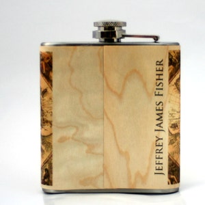 May include: A stainless steel flask with a wood grain design and the name "JEFFREY JAMES FISHER" printed on the side.