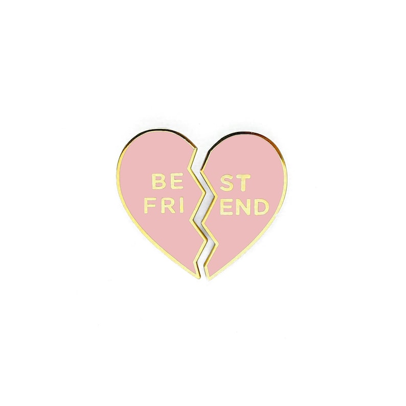 simple and fun best friend enamel pin  in the shape of a heart