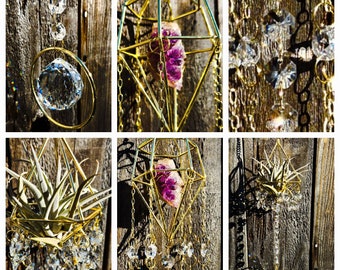 May include: A set of three gold geometric hanging planters with crystal accents. Each planter features a different design, including a diamond shape, a circle, and a teardrop shape. The planters are perfect for displaying air plants or other small plants.