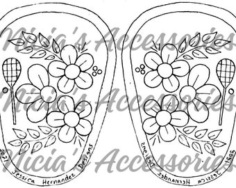 May include: A black and white line drawing of two tennis racquet shaped embroidery patterns. Each pattern features a cluster of three flowers with five petals, a stem with leaves, and a tennis racquet. The text "2021 Designs" is at the bottom of the left pattern and the text "2021 Designs" is at the bottom of the right pattern.